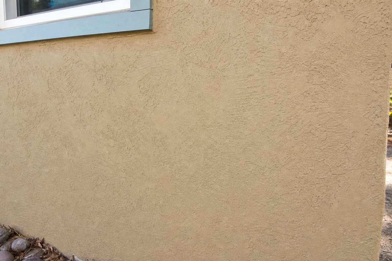 Color matched stucco texture repair close-up in Santa Fe